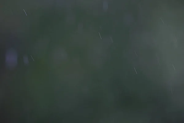 Raindrops flowing  down the glass — Stock Photo, Image