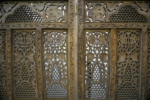 Wooden carved screen near the wall — Stock Photo, Image