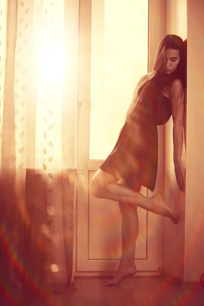 Teenage girl near window — Stock Photo, Image