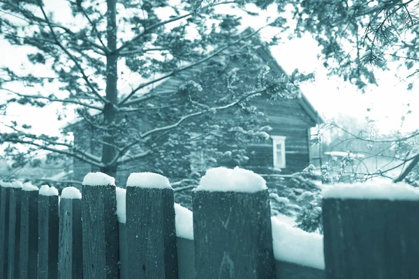 snow on wooden  fence