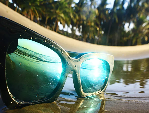 sun glasses  lying on the beach