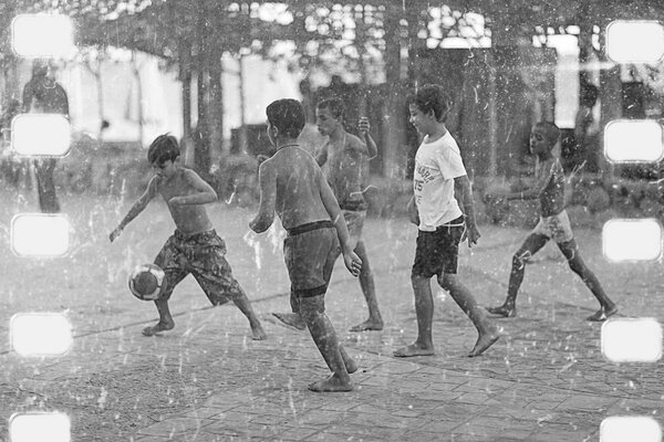 boys playing  football. 