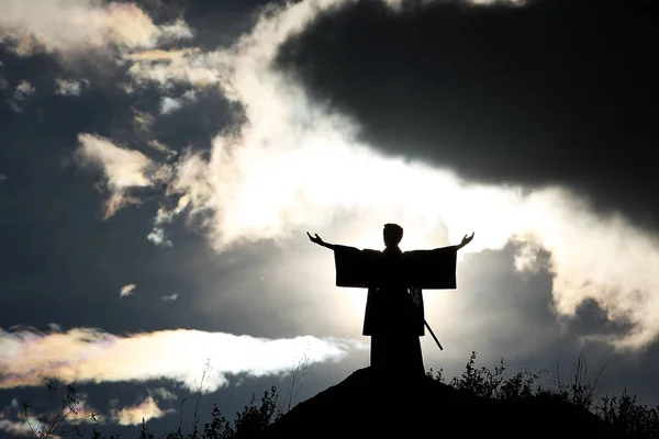 Silhouette monk on the mountain. — Stock Photo, Image
