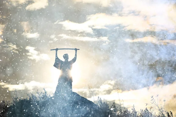 Silhouette of warrior holding sword — Stock Photo, Image