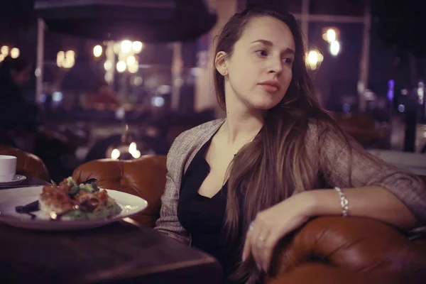 pensive woman in restaurant