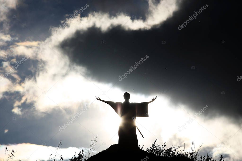 Silhouette monk on the mountain.