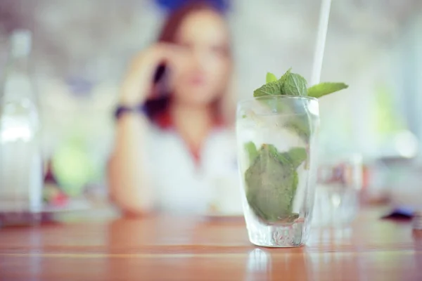 Young woman relaxing in restaurant — Stock Photo, Image