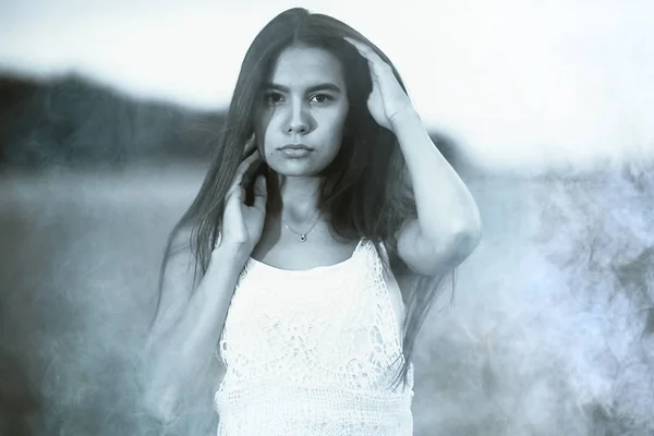 Woman with long hair in wheaten field — Stock Photo, Image