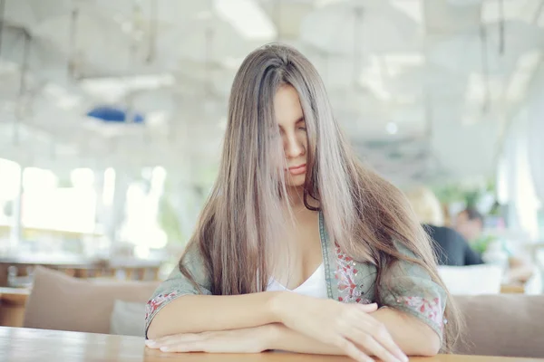 Young woman in cafe — Stock Photo, Image