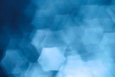 Mavi bokeh ışıkları ile soyut sihirli doku, fantezi arka plan bulanık.   