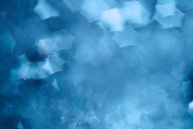 Mavi bokeh ışıkları ile soyut sihirli doku, fantezi arka plan bulanık.   