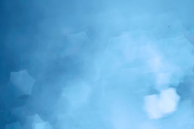 Mavi bokeh ışıkları ile soyut sihirli doku, fantezi arka plan bulanık.   