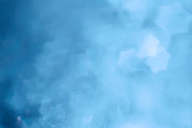 Mavi bokeh ışıkları ile soyut sihirli doku, fantezi arka plan bulanık.   