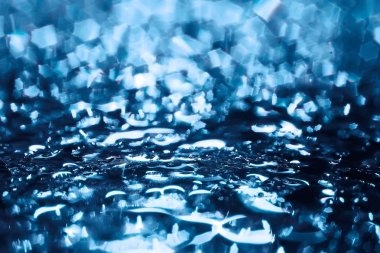 Mavi bokeh ışıkları ile soyut sihirli doku, fantezi arka plan bulanık.   