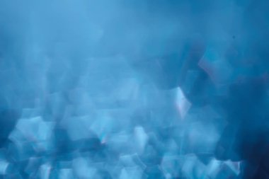 Mavi bokeh ışıkları ile soyut sihirli doku, fantezi arka plan bulanık.   