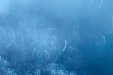 Mavi bokeh ışıkları ile soyut sihirli doku, fantezi arka plan bulanık.   