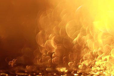 Altın bokeh ışıkları ile soyut sihirli doku, fantezi arka plan bulanık.   