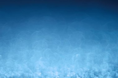 Mavi bokeh ışıkları ile soyut sihirli doku, fantezi arka plan bulanık.   