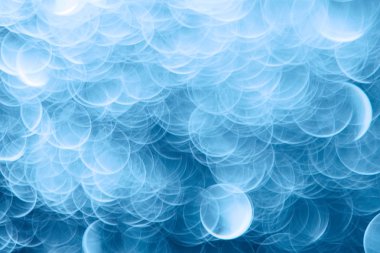 Mavi bokeh ışıkları ile soyut sihirli doku, fantezi arka plan bulanık.   