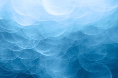 Mavi bokeh ışıkları ile soyut sihirli doku, fantezi arka plan bulanık.   