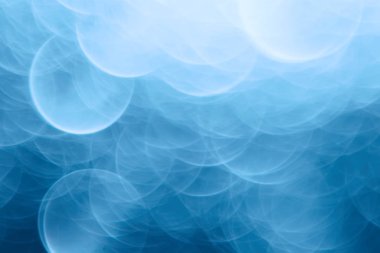 Mavi bokeh ışıkları ile soyut sihirli doku, fantezi arka plan bulanık.   