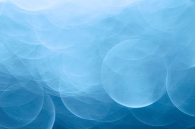 Mavi bokeh ışıkları ile soyut sihirli doku, fantezi arka plan bulanık.   