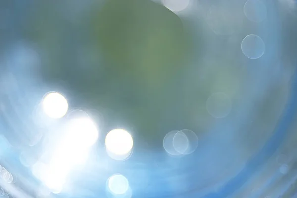 blurry lens flare abstract background, white and blue light