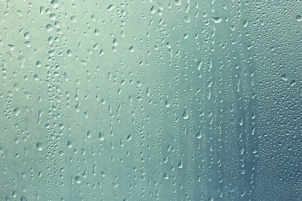 Gotas de lluvia en vidrio de ventana —  Fotos de Stock