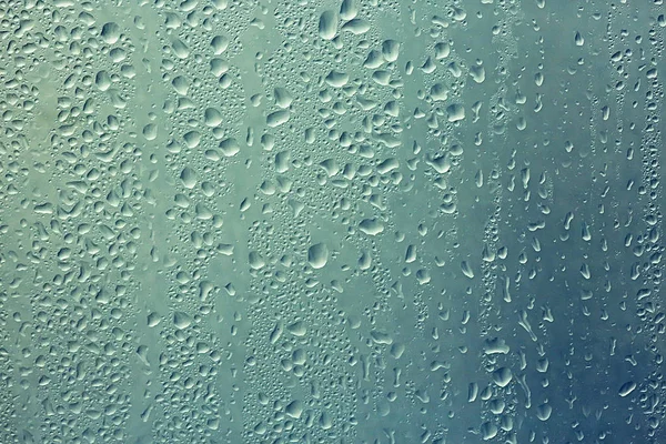 Gotas de lluvia en vidrio de ventana —  Fotos de Stock