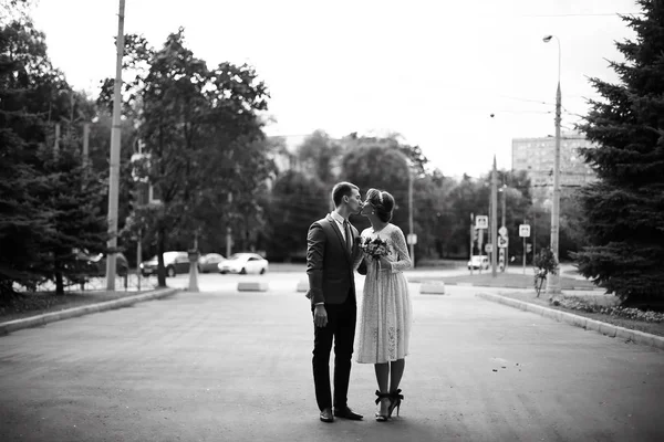 bride and groom in park