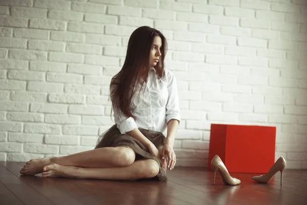 Beautiful young woman with shoes — Stock Photo, Image