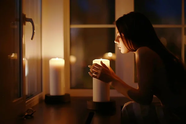 Woman with burning candles — Stock Photo, Image