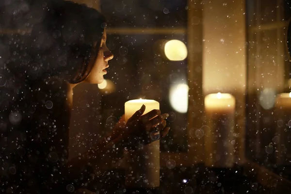 Woman with burning candles — Stock Photo, Image