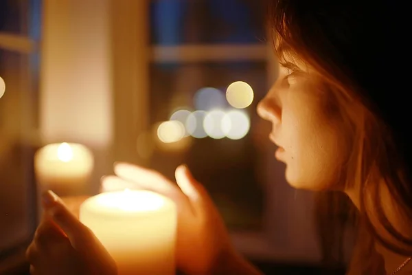 woman with burning candle