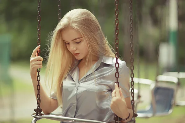 Woman at chain merry-go-round — Stock Photo, Image