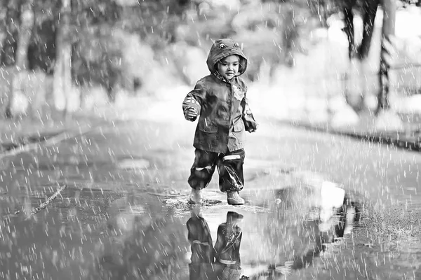 little girl in rainy park