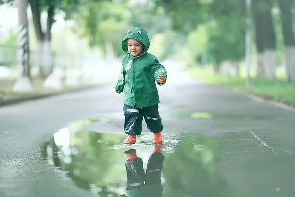 little girl in rainy park