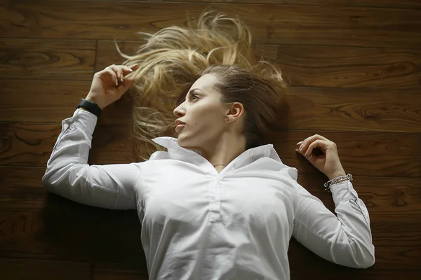 Woman on wooden floor — Stock Photo, Image