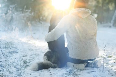 man and dog are sitting with their backs to the frame, the concept of psychology is sadness, caring friendship