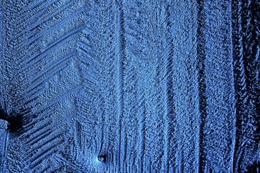 Mavi buzlu cam arka plan, buzun yüzeyinin soyut dokusu, donmuş mevsimlik su.