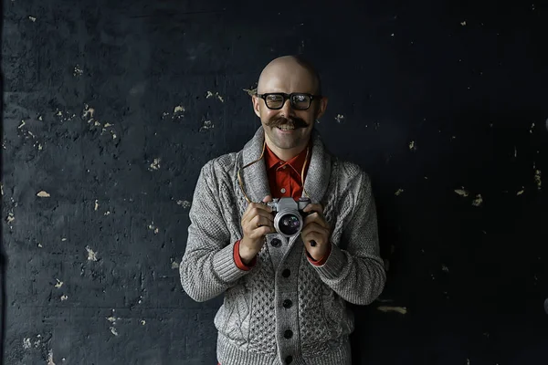 photographer with a vintage analog camera, a man with mustache, funny image learning photography