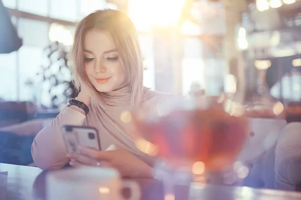 young model drinks tea in a cafe, vacation concept table setting