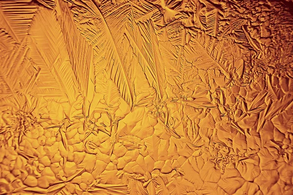 黄金の氷の背景抽象的な黄色の背景寒い季節の珍しい氷休日のテクスチャ — ストック写真
