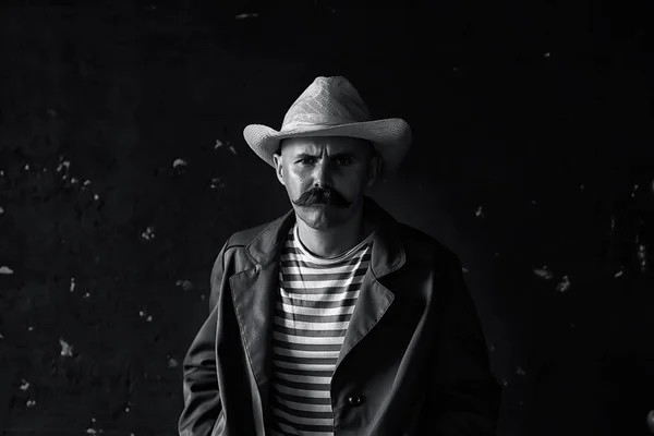 stylized vintage portrait of a man wild west, mustachioed dangerous criminal, mustache on his face