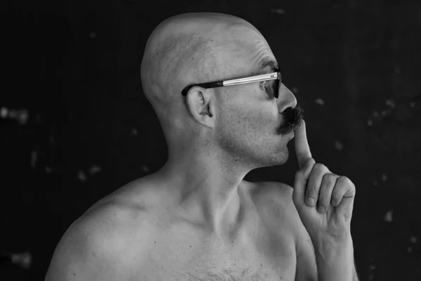 unusual portrait of a bald mustachioed young gentleman, eccentric mister, psychology concept