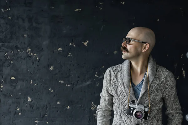 photographer with a vintage analog camera, a man with mustache, funny image learning photography