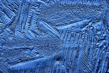 Mavi buzlu cam arka plan, buzun yüzeyinin soyut dokusu, donmuş mevsimlik su.