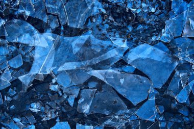 Mavi buzlu cam arka plan, buzun yüzeyinin soyut dokusu, donmuş mevsimlik su.