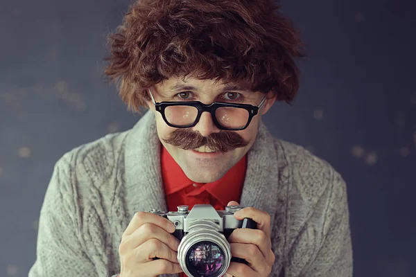 photographer with a vintage analog camera, a man with mustache, funny image learning photography