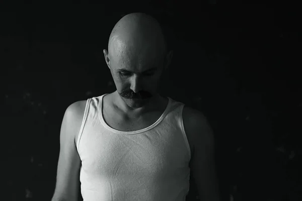 unusual portrait of a bald mustachioed young gentleman, eccentric mister, psychology concept